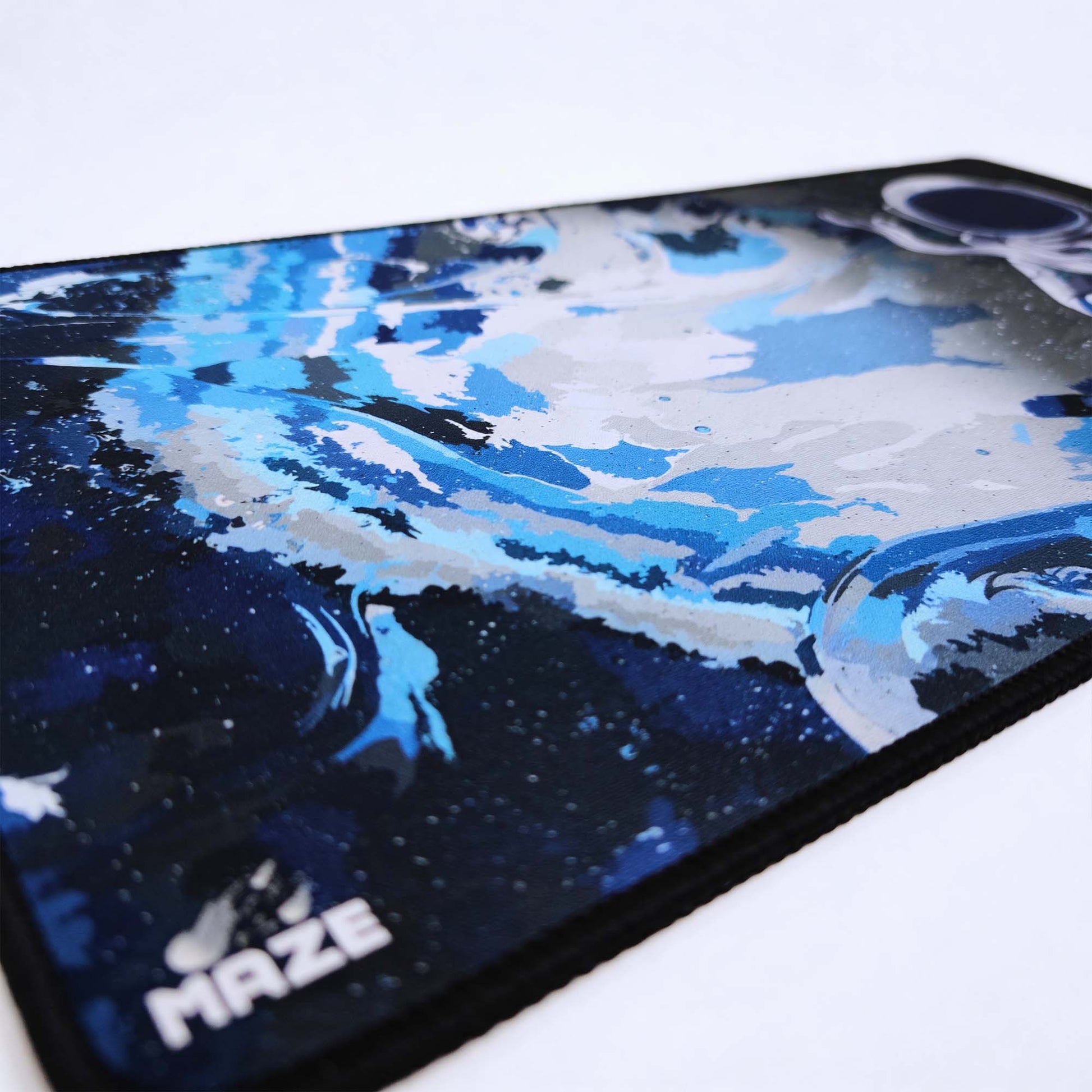 Gaming mouse pad with blue and black abstract design on a white background