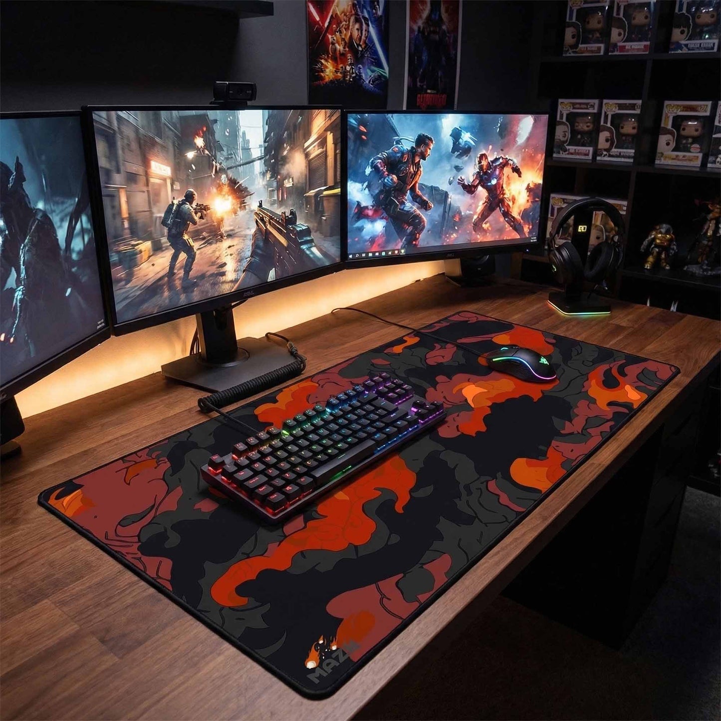 Gaming setup with multiple monitors, keyboard, and mouse on a large mouse pad.
