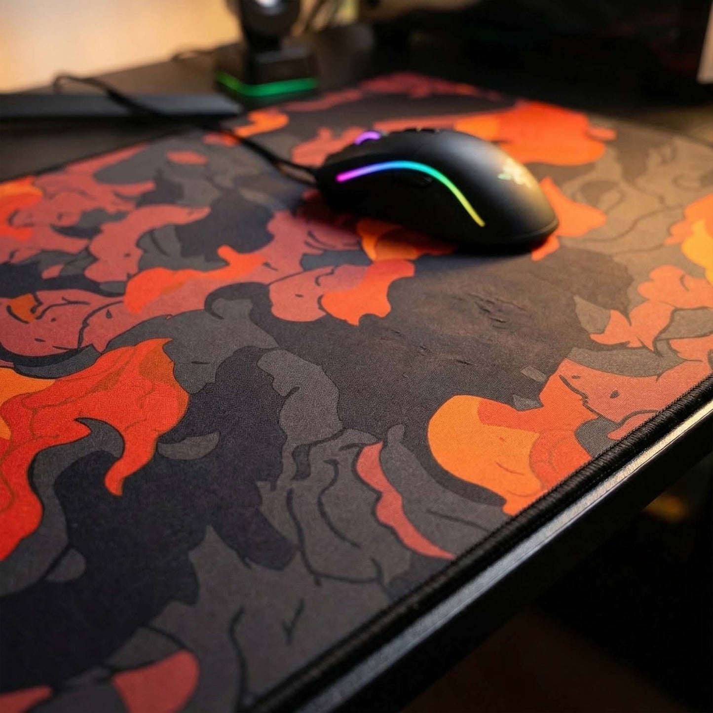 Gaming mouse with RGB lighting on a camouflage-patterned mouse pad