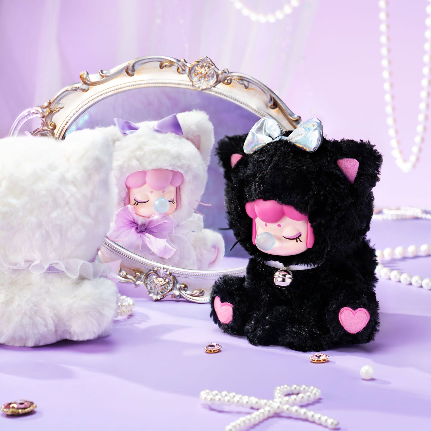 Black plush toy with pink accents and a white mirror on a purple background
