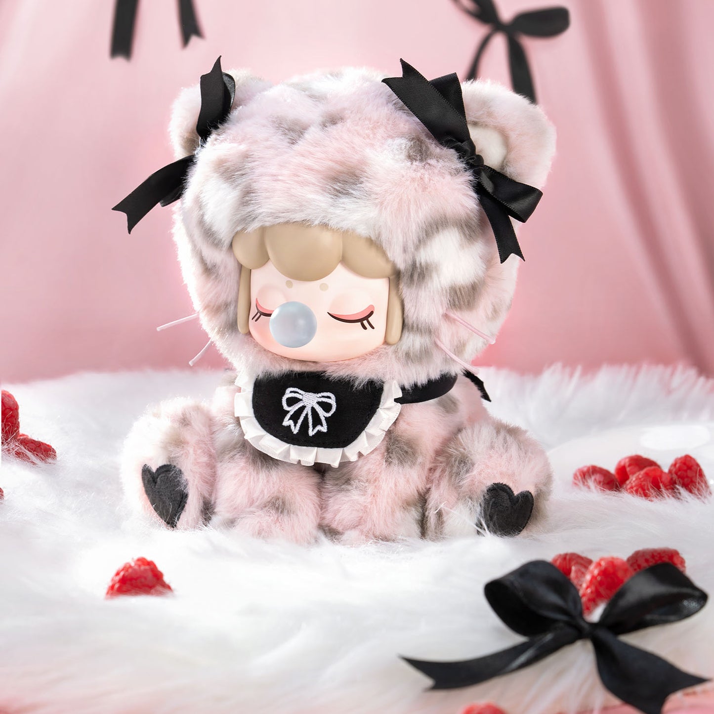 Plush toy with a cute design on a pink background