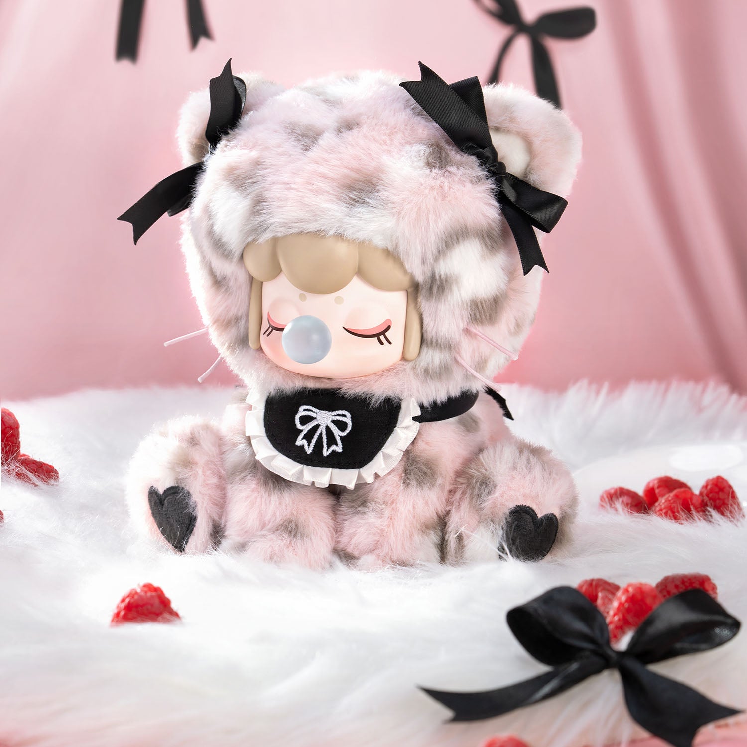 Plush toy with a cute design on a pink background