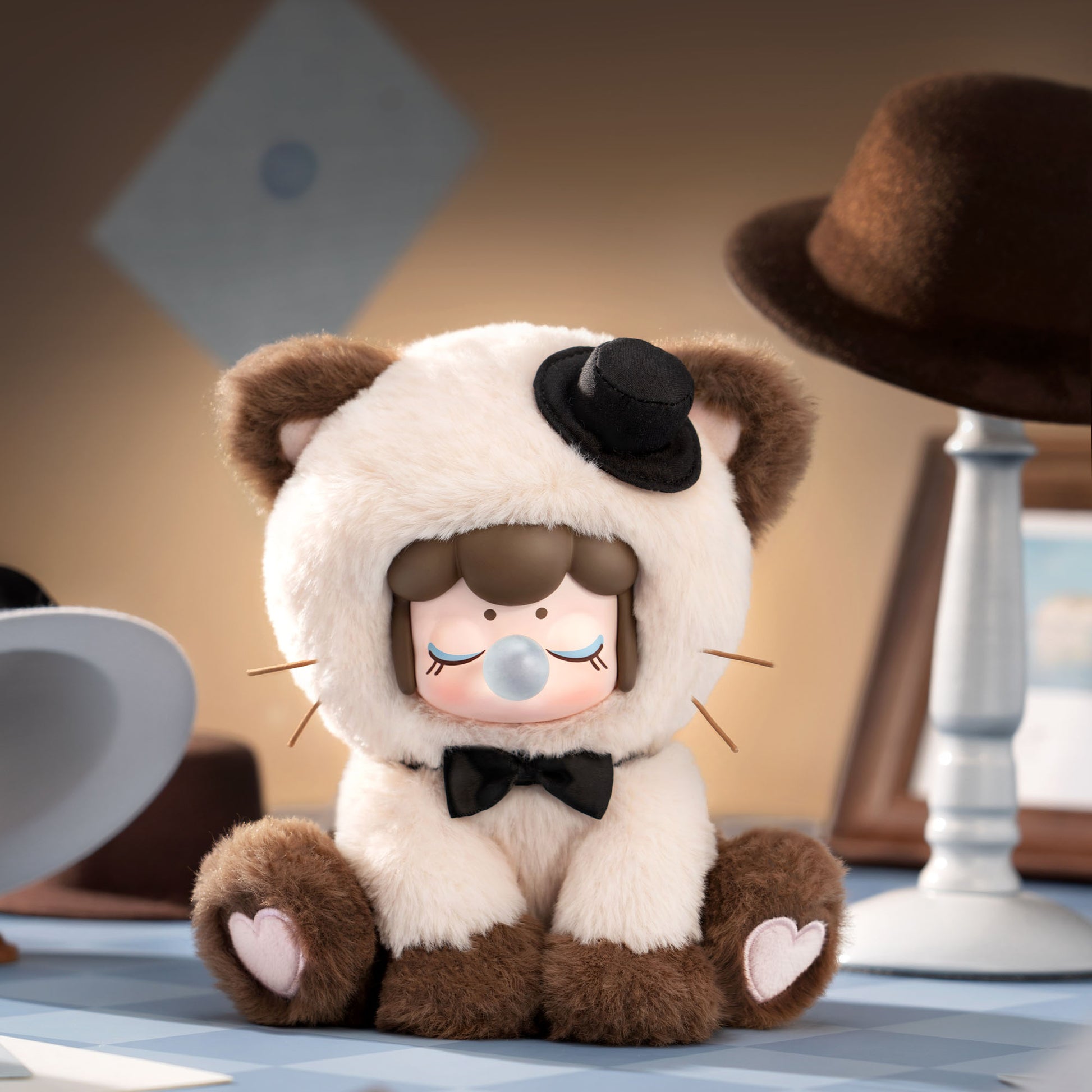 Plush toy with panda and bear design on a neutral background