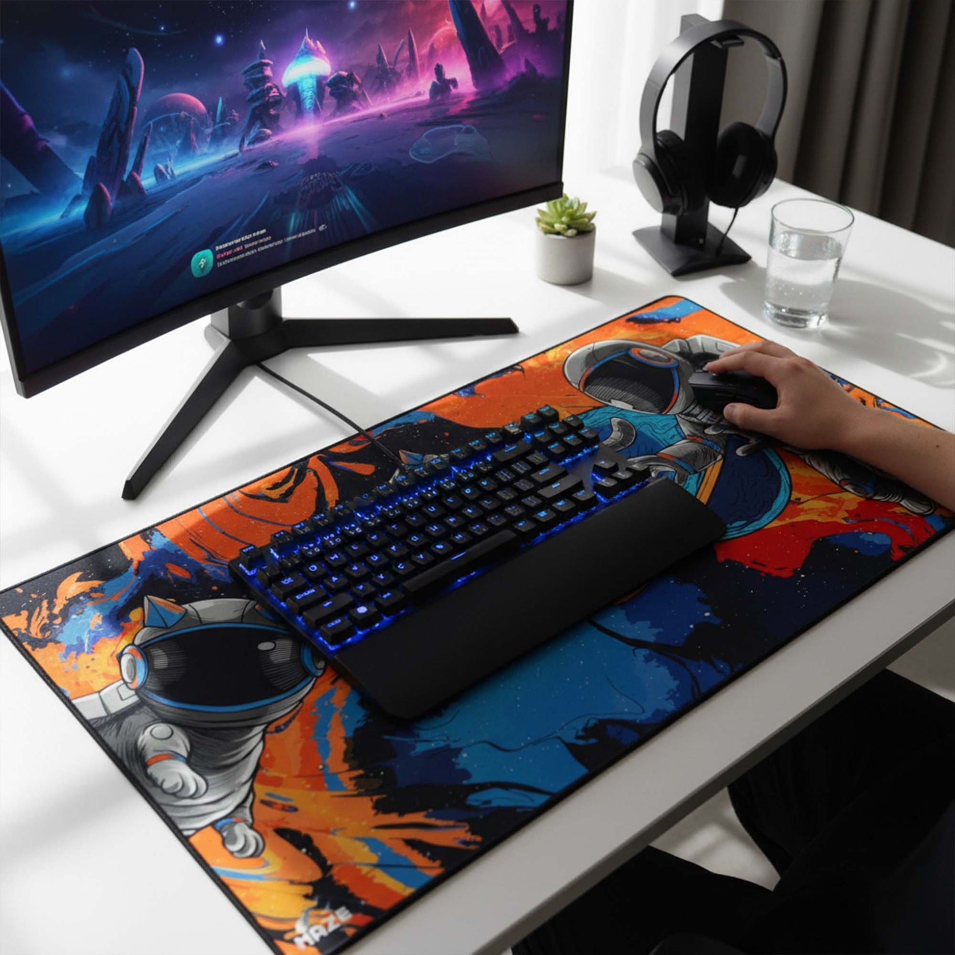 Gaming setup with a monitor, keyboard, mouse, and mouse pad on a desk.