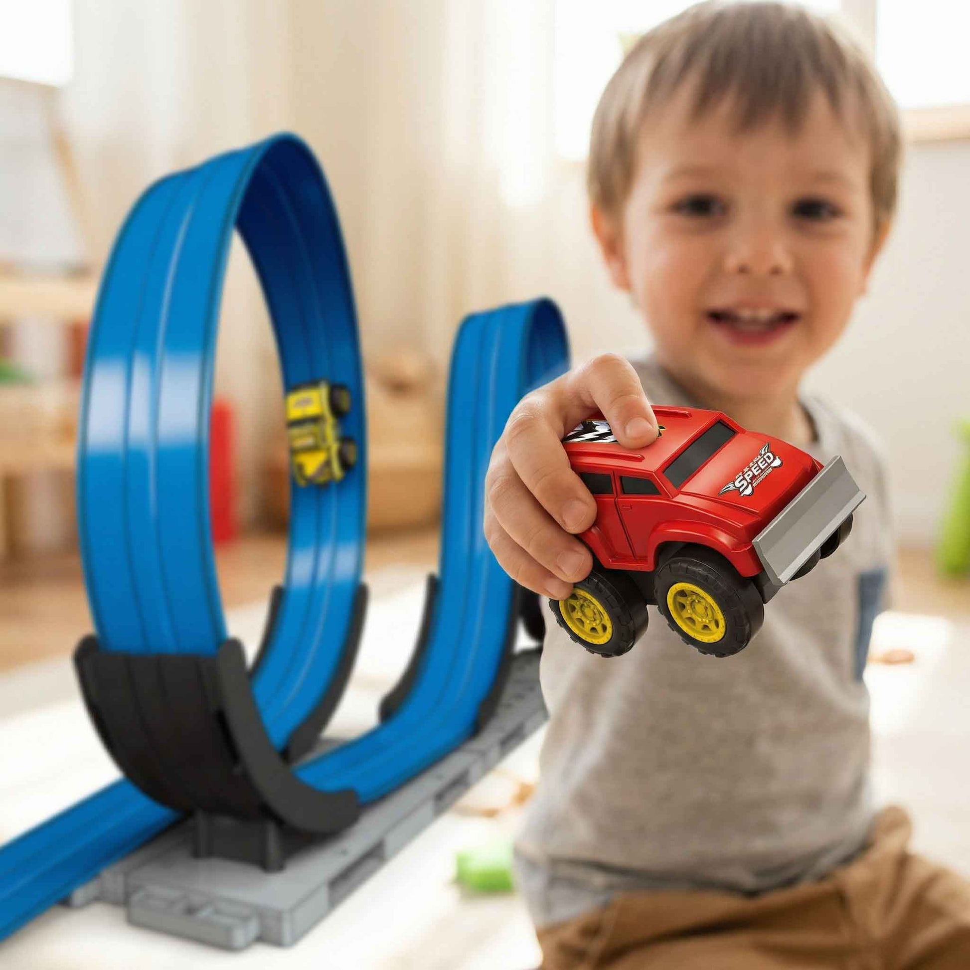 Racing track loop toy set with red and yellow cars included