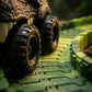Close-up of toy tank tracks on a textured green surface