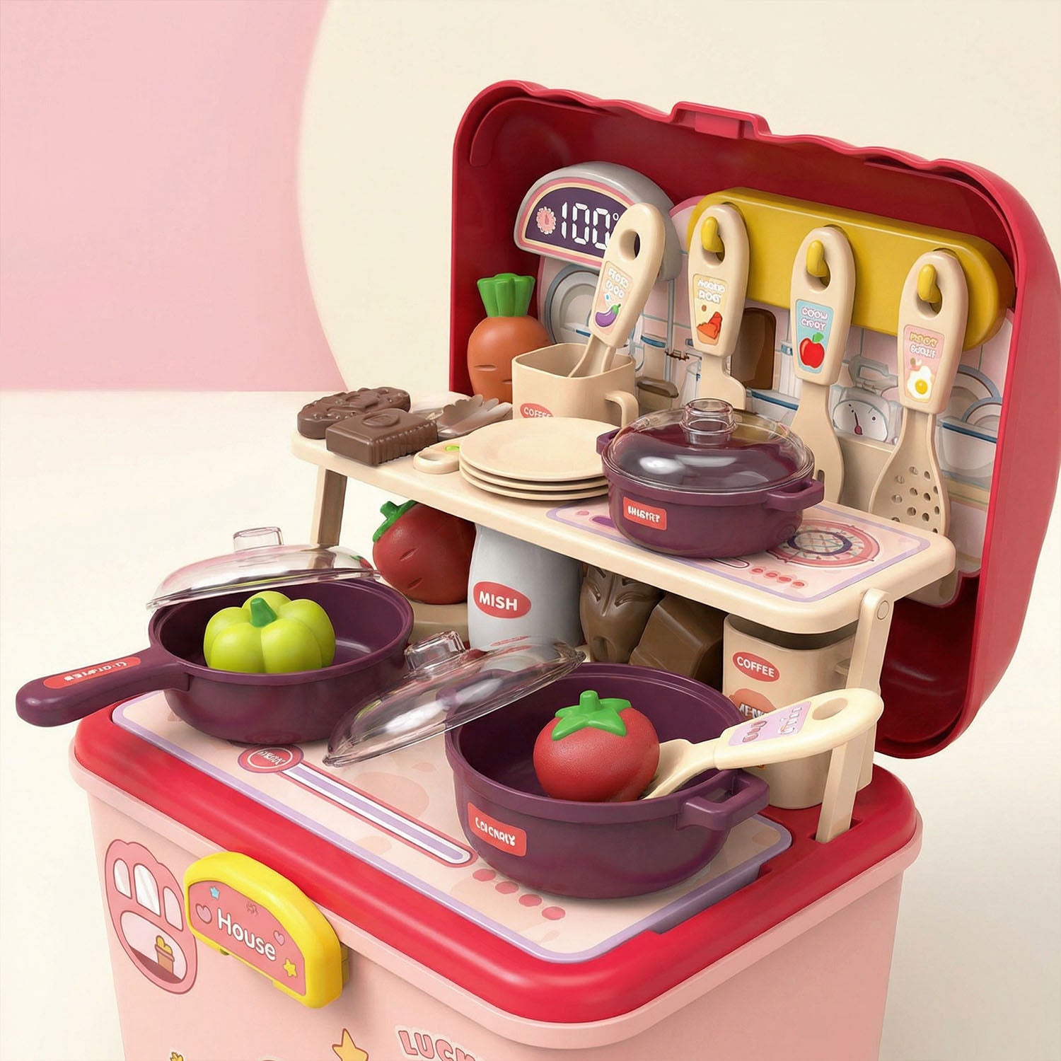 Toy kitchen set with various utensils and cookware 