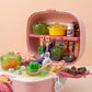 Pink toy kitchen set with various utensils and food items 