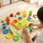 Children modeling clay dinosaur toy set