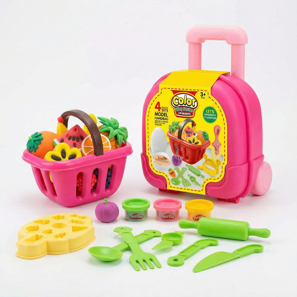 Colorful toy kitchen set with a pink suitcase, fruits, vegetables, and utensils