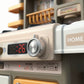 Interactive toy kitchen with steam