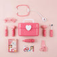 Pink toy doctor's kit with various medical tools 