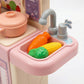 Toy kitchen set with sink, vegetables, and faucet 