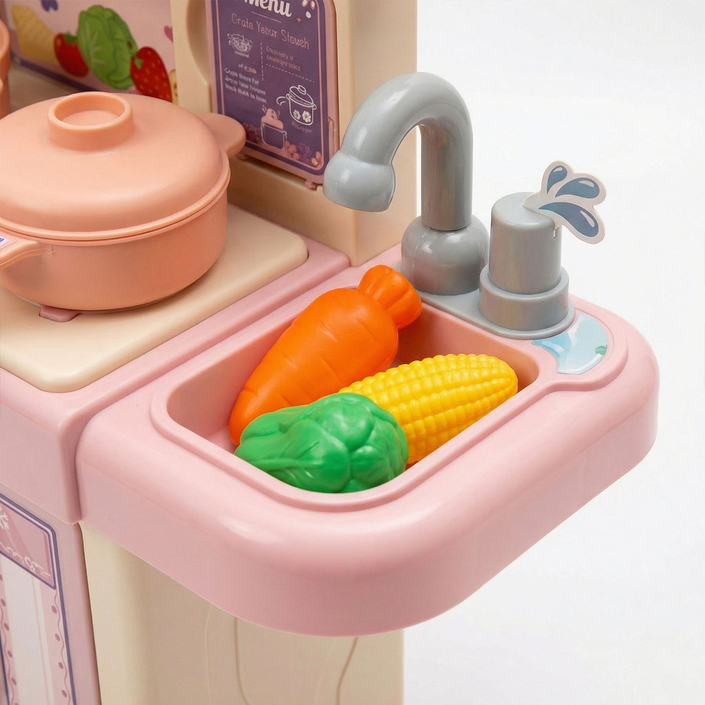 Toy kitchen set with sink, vegetables, and faucet 