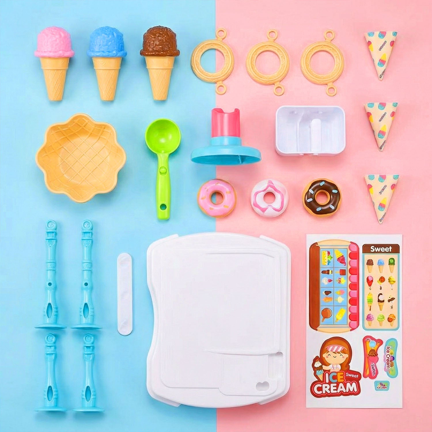 Collection of toy ice cream cones, utensils, and a toy ice cream truck on a two-tone blue and pink background.