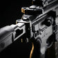 Close-up of a rifle with a scope on a dark background