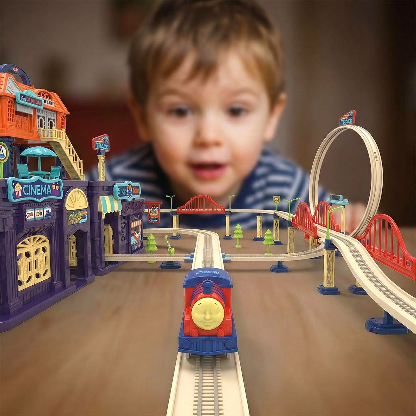 Children playing with Track City train playset