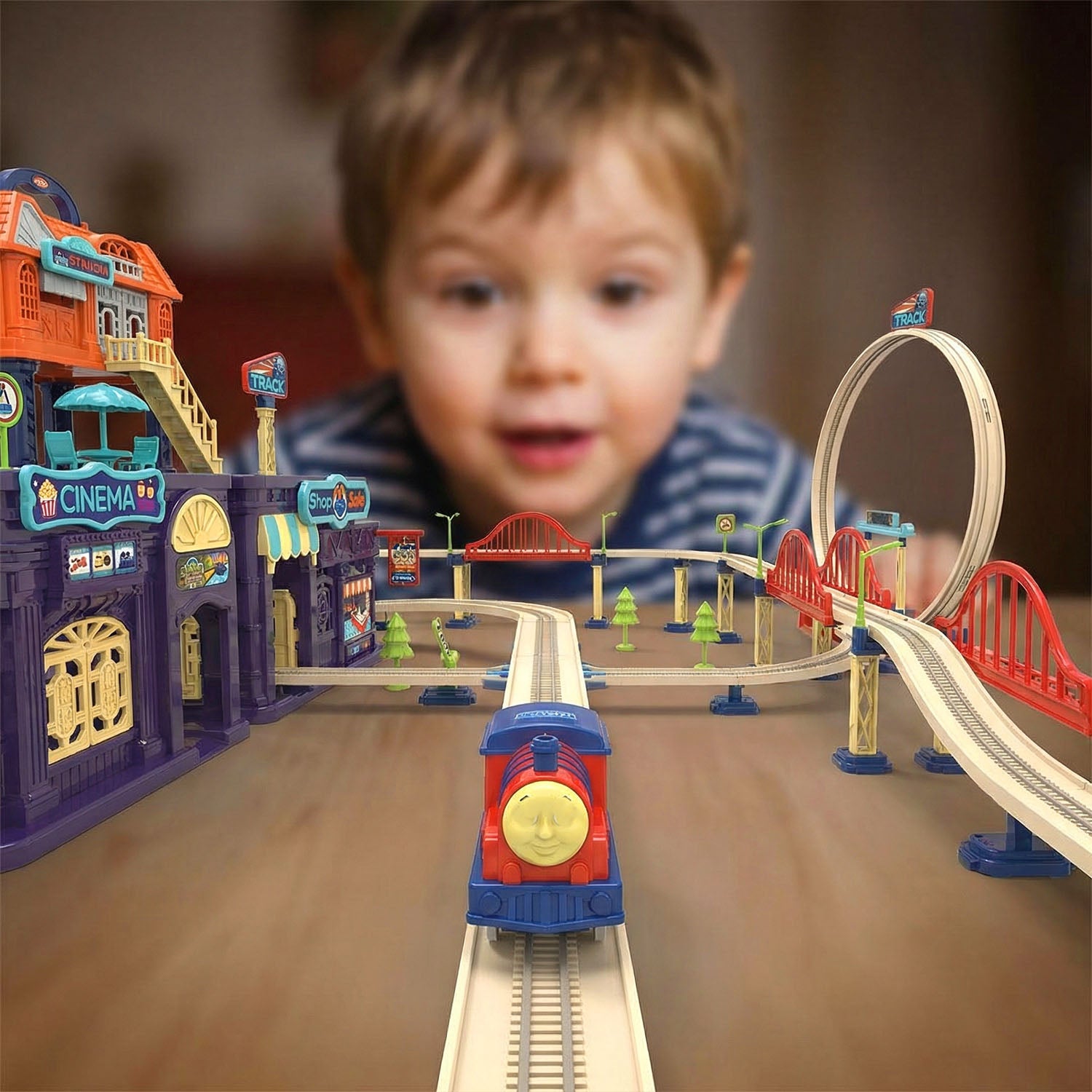 Children playing with Track City train playset